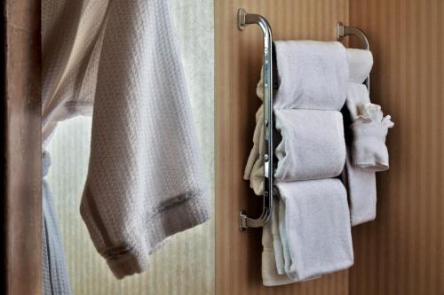 a group of towels hanging on a rack in a bathroom at Crowne Plaza Hotel Portland-Downtown Convention Center by IHG in Portland
