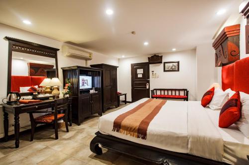 Katil atau katil-katil dalam bilik di Raming Lodge Hotel