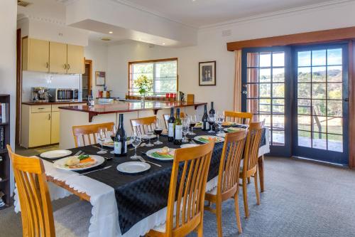 a kitchen and dining room with a table and chairs at Indigo Vineyard Farmstay in Beechworth