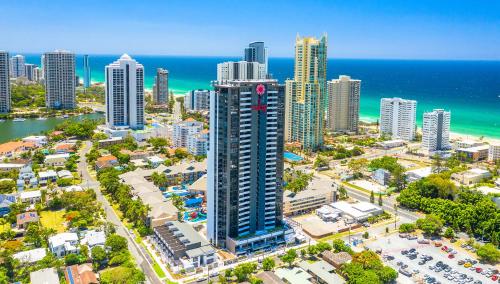 a city with tall buildings and palm trees at Ruby Gold Coast in Gold Coast