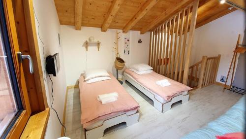 a room with two beds in a room at Le camp de base in Chamonix-Mont-Blanc