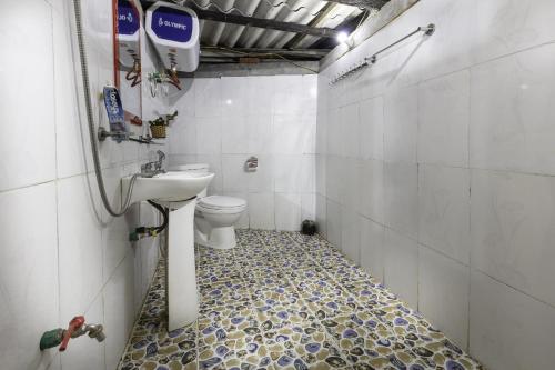 a bathroom with a sink and a toilet at Hmong Sister House and Trekking in Sa Pa