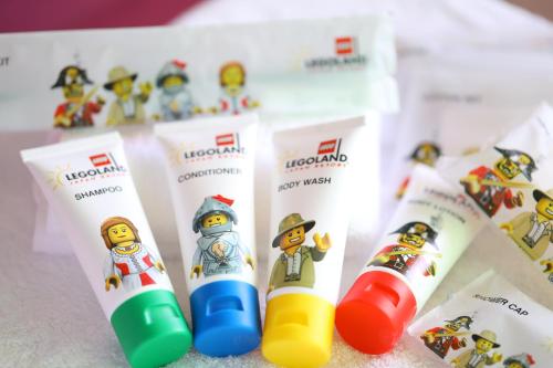 a group of toothbrushes are lined up on a counter at LEGOLAND Japan Hotel in Nagoya