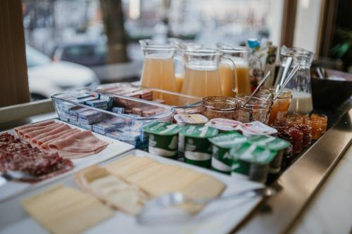 a buffet of food and drinks on a table at Grand Hôtel de Valenciennes in Valenciennes