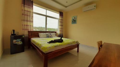 Кровать или кровати в номере Song Huong Hotel Mui Ne