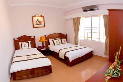 Giường trong phòng chung tại Ocean Star Hotel