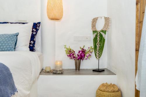 Ένα ή περισσότερα κρεβάτια σε δωμάτιο στο DHYANA VILLAS