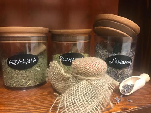 two glass jars filled with seeds on a table at Nowa - Ski SPA Hotel in Karpacz