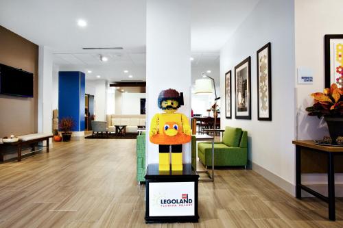 a lego man standing on a box in a lobby at Holiday Inn Express Lake Wales North-Winter Haven, an IHG Hotel in Waverly