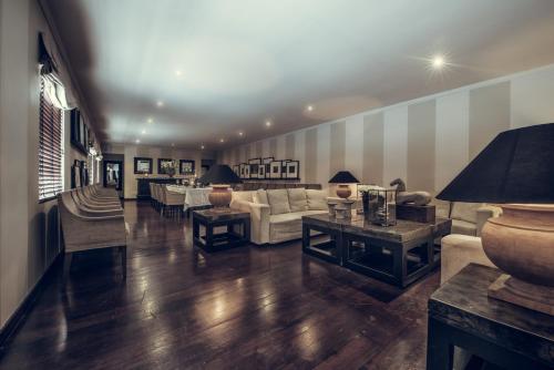 a living room with a couch and a table at Paradise Road Tintagel Colombo in Colombo