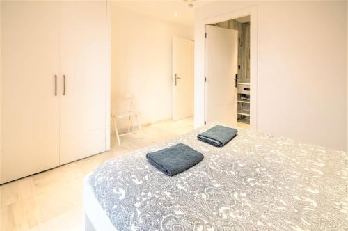 a bedroom with a bed with two pillows on it at Marble Lodge Apartments in the Center of Antwerp in Antwerp