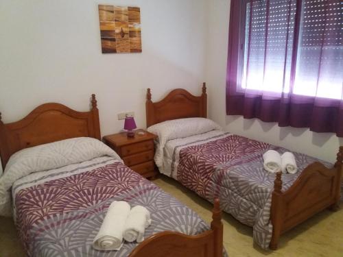 Katil atau katil-katil dalam bilik di Apartamento ALVARO