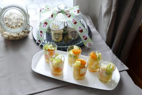a tray with several cups of drinks on a table at La Garonde in Berthen