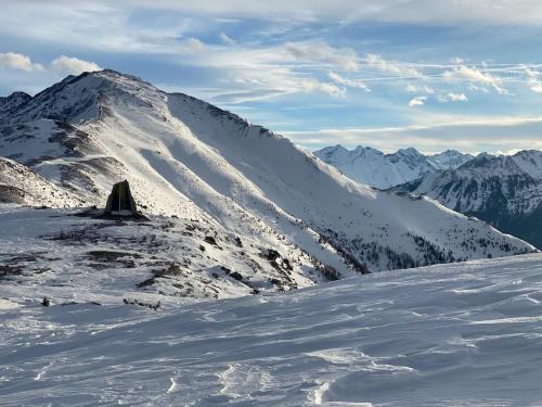 a mountain with snow on it with mountains in the background at Landhaus Zangerl - Kobelerhof in Landeck