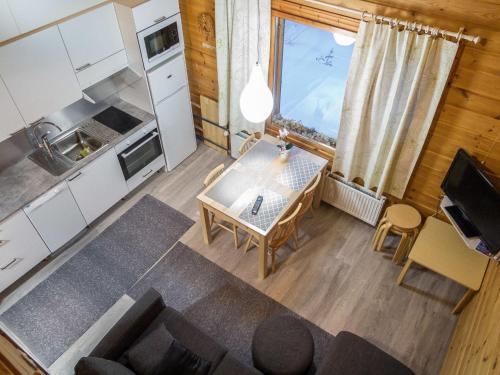 an overhead view of a kitchen and a table in a room at Holiday Home Lähikaltio 314 by Interhome in Äkäslompolo