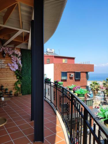 a balcony with a view of the ocean at Teacher Cai Homeestay in Xiaoliuqiu