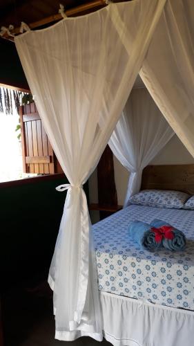 Ένα ή περισσότερα κρεβάτια σε δωμάτιο στο Casas Belas de Taipu