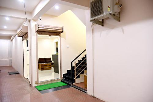 an open hallway with a staircase in a house at The INN in Mysore