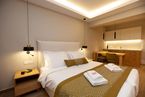 Postel nebo postele na pokoji v ubytování No21 Luxury Suites