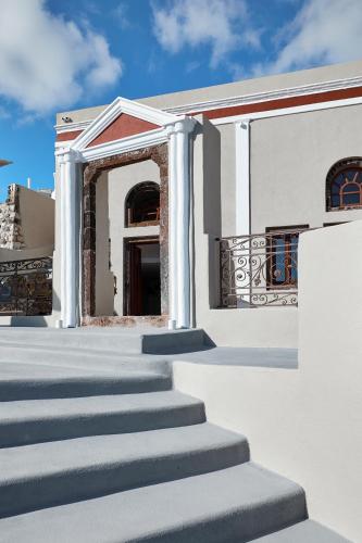 a set of stairs leading up to a building at Nano Suites in Éxo Goniá