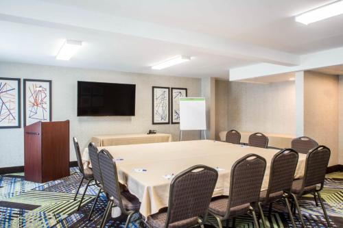 a conference room with a large table and chairs at Holiday Inn Express & Suites - Albany Airport - Wolf Road by IHG in Albany
