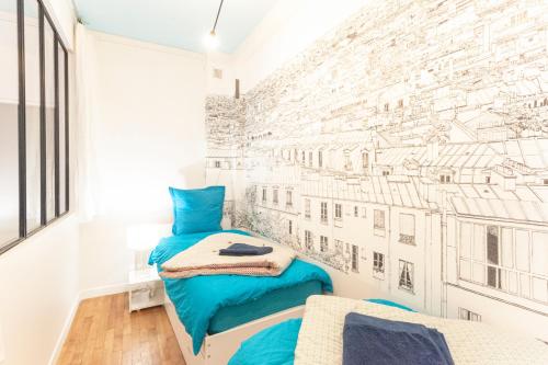 a bedroom with a wall mural of buildings at Central Luxury Louvre Opera 3rd Floor in Paris