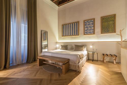 a bedroom with a bed and a table in it at ICON Rosetó in Palma de Mallorca