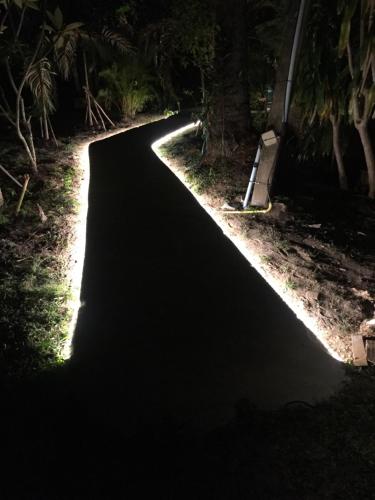 a road lit up at night with at Andaman Sunflower in Ko Lanta