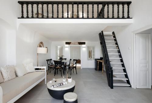 a living room with a couch and a table at Nano Suites in Éxo Goniá