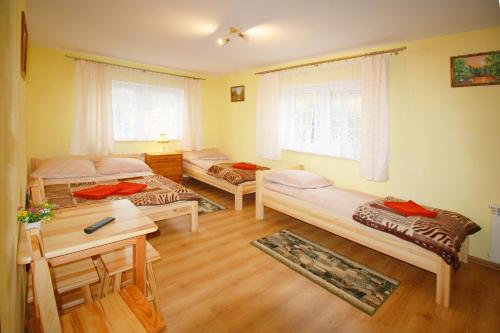 Posteľ alebo postele v izbe v ubytovaní Przystań Laworta