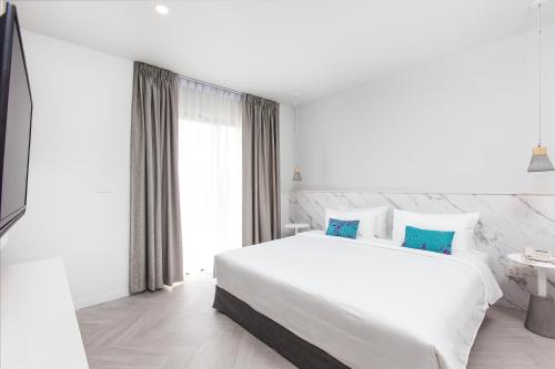 Postel nebo postele na pokoji v ubytování Sook Hotel