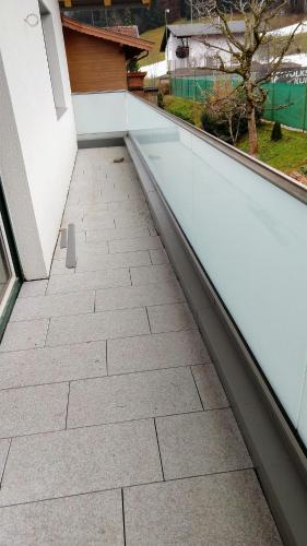 a walkway on a balcony with a view of a pool at Appartement Ingrid in Ellmau