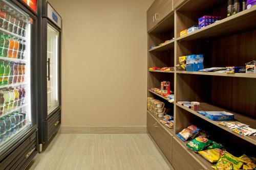 a walk in pantry with lots of food at Holiday Inn Express Hotel & Suites Minneapolis - Minnetonka by IHG in Minnetonka