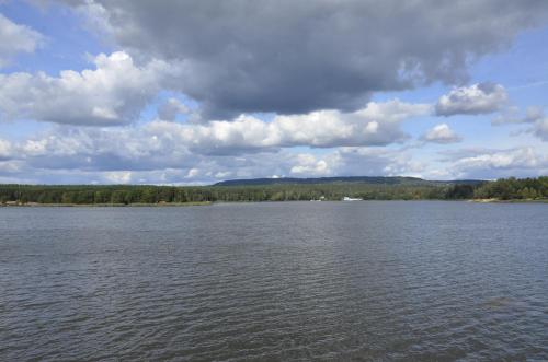 a large body of water under a cloudy sky at "11" SŁOŃCE WODA LAS - Apartament No11 Garaż w cenie in Kielce