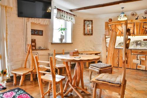 a dining room with a table and chairs at Грибова хата in Bukovel