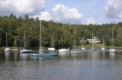 a group of boats sitting in the water at "11" SŁOŃCE WODA LAS - Apartament No11 Garaż w cenie in Kielce