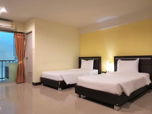 Säng eller sängar i ett rum på Phupara Place SHA Certified