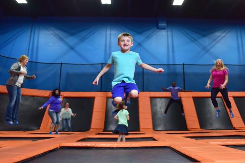 a young boy jumping in a trampoline park at Staybridge Suites - Wisconsin Dells - Lake Delton by IHG in Wisconsin Dells