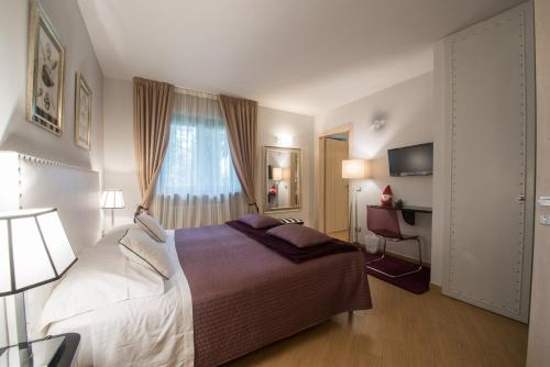 Postel nebo postele na pokoji v ubytování Residenza Ca' degli Enzi