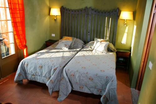 a bedroom with a large bed in a room at I Veroni - Agriturismo and Wine Cellar in Pontassieve