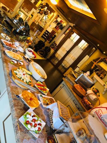 a buffet line with many different types of food at 2 KITARRAT Boutique Hotel & SPA in Durrës