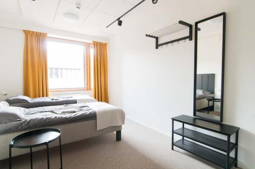 Ένα ή περισσότερα κρεβάτια σε δωμάτιο στο Moi Aikatalo Hostel Helsinki