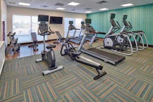a gym with several exercise bikes and treadmills at Holiday Inn Express & Suites El Paso - Sunland Park Area by IHG in El Paso