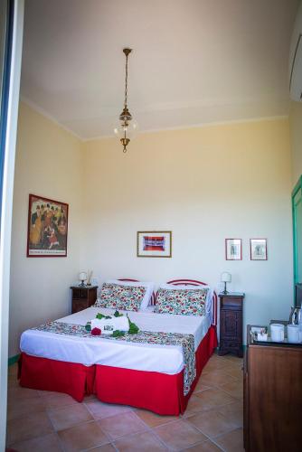 a bedroom with a large bed in a room at B&B La Residenza Torchiara in Torchiara