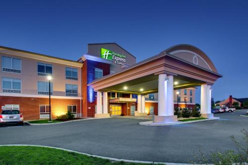 a hotel with a parking lot in front of it at Holiday Inn Express & Suites Lancaster East - Strasburg by IHG in Strasburg