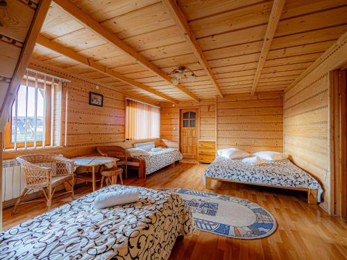 Un pat sau paturi într-o cameră la Dom Wypoczynkowy u Gałów