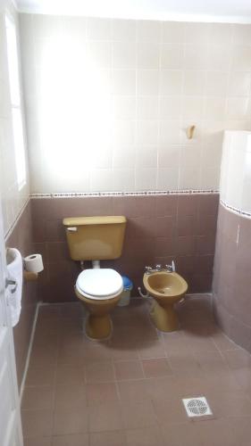 a bathroom with a toilet and a bidet at Buen Descanso in Salta