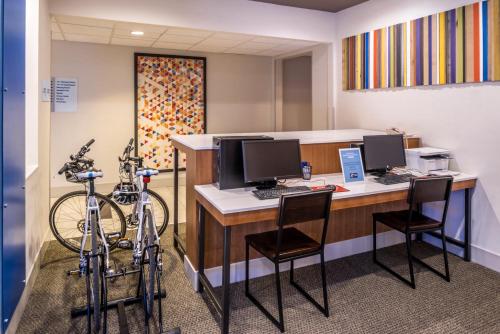 an office with a desk with two computers and two bikes at Holiday Inn Express Sierra Vista by IHG in Sierra Vista