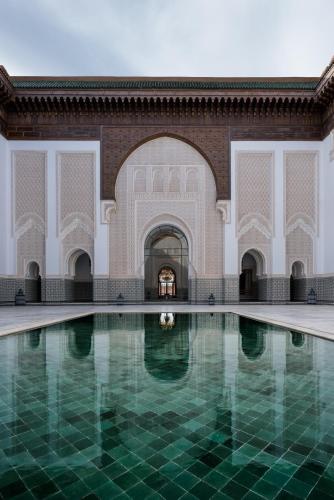 a pool in the courtyard of a mosque at The Oberoi Marrakech in Marrakech