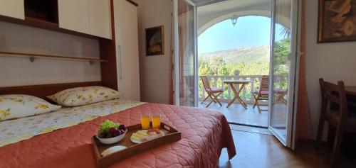 A bed or beds in a room at Two Palms Villa